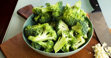 green broccoli on brown wooden chopping board