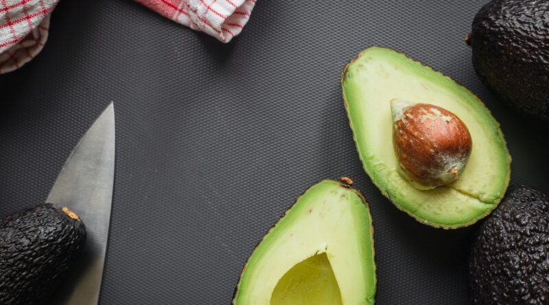 sliced avocado fruit on black textile